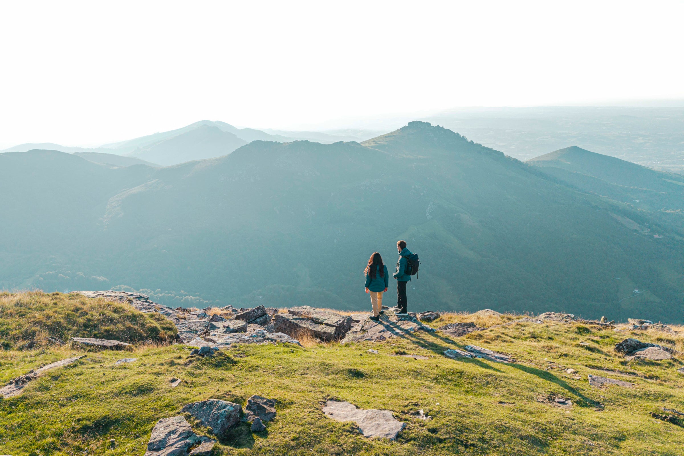 Two hikers on a mountain ridge