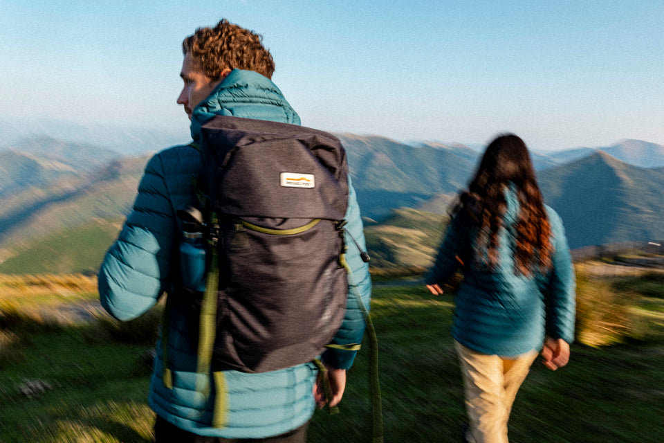 Two hikers walking in the mountains